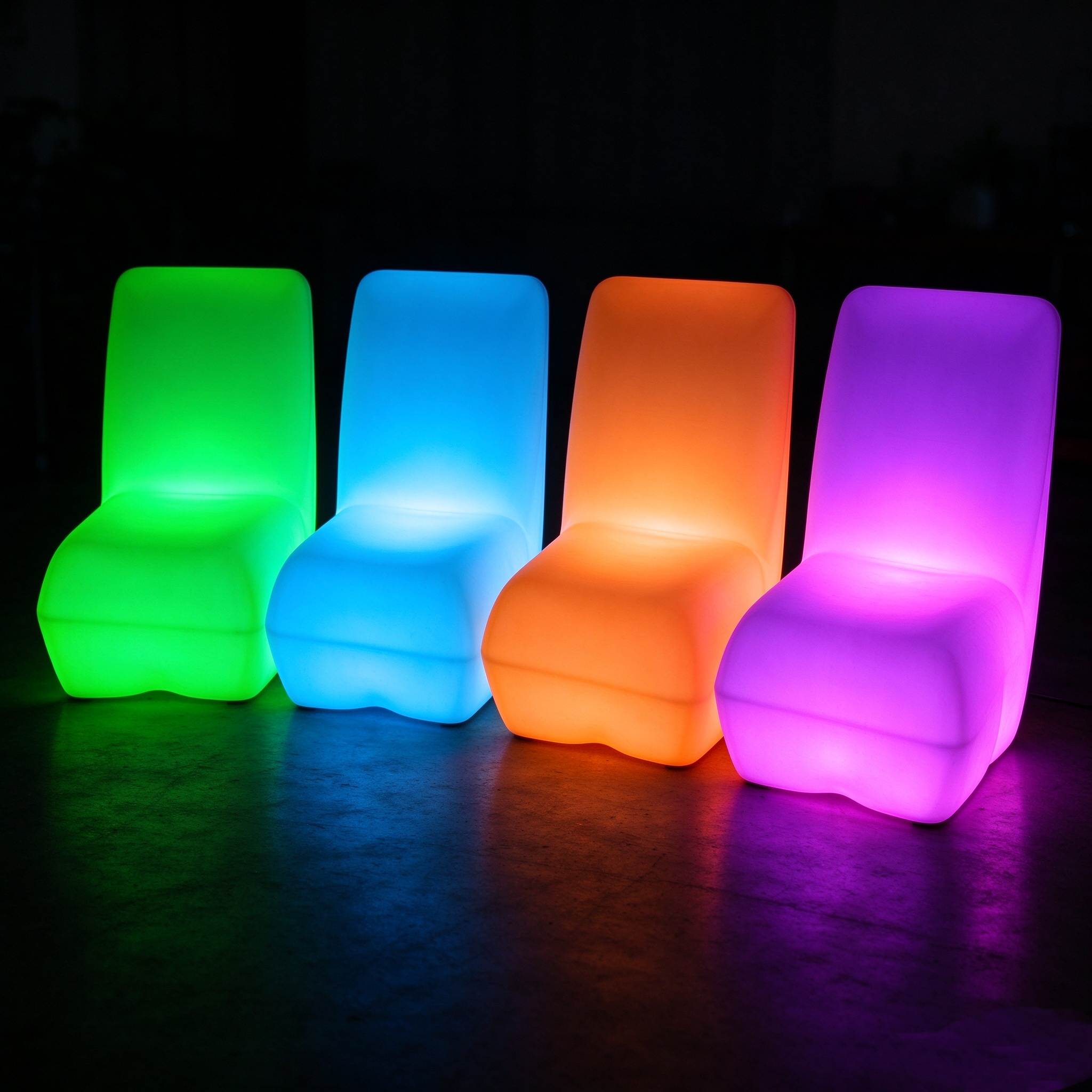 Multi-Color LED Rotomolded Lounge Chair Set Four LED rotomolded lounge chairs glowing in green, blue, orange and purple, showing the multi-color lighting function for outdoor bars and parties.